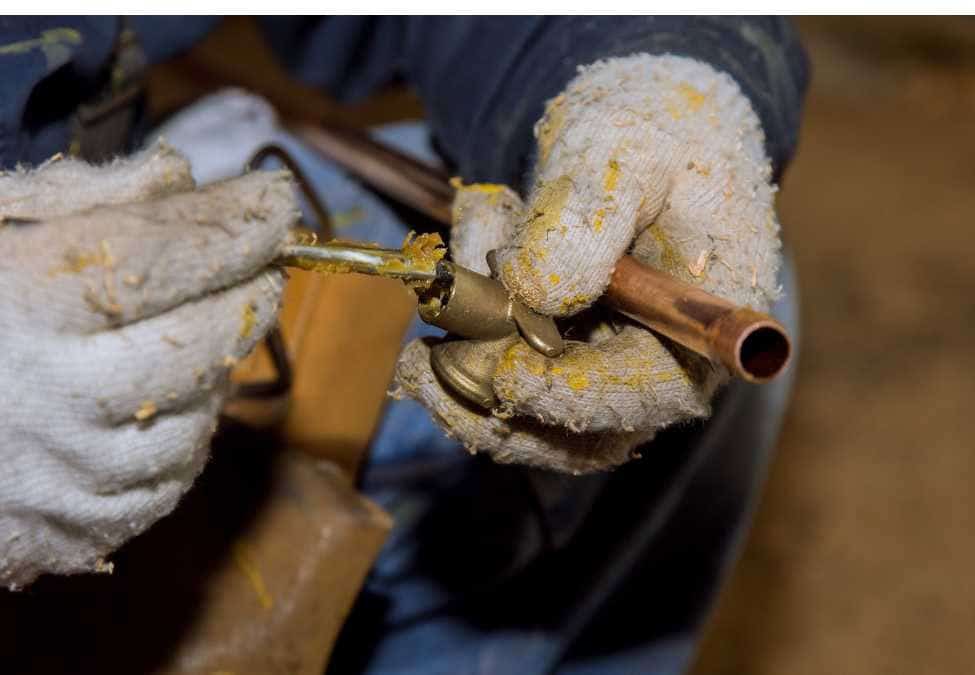 Apply flux to the fitting and pipe