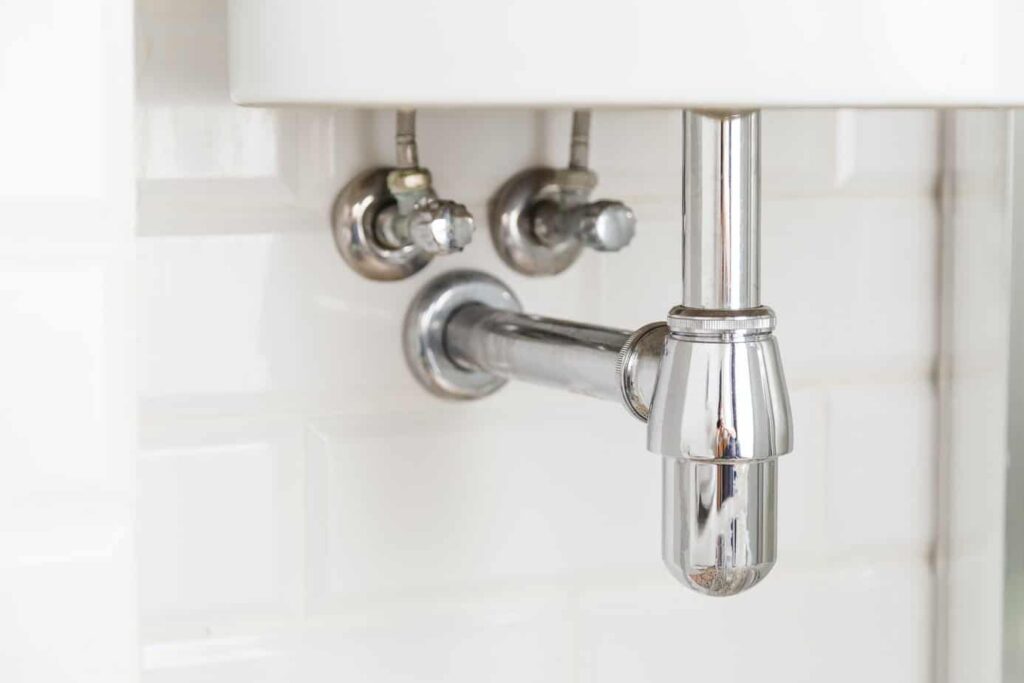 Basin siphon or sink drain in a bathroom, clean