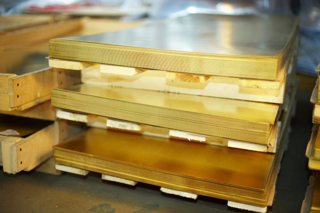 Many brass sheets in warehouse